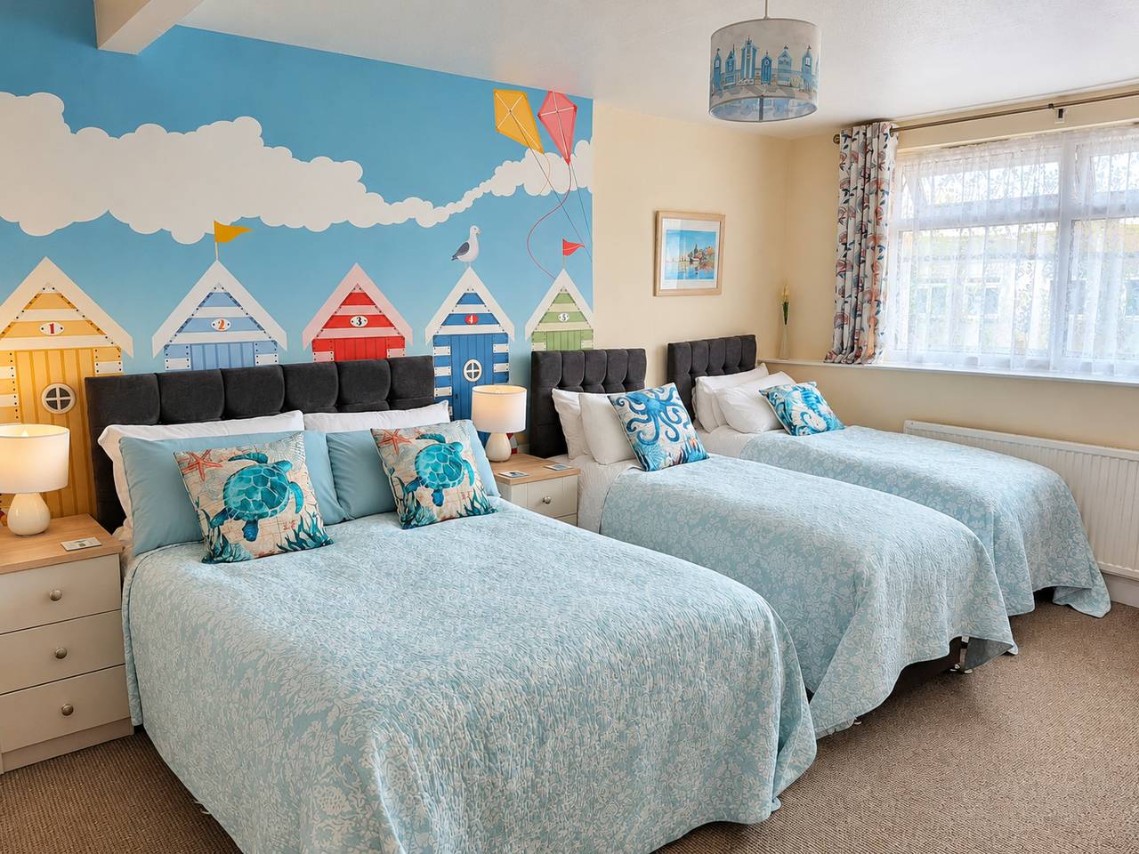 Family en-suite room with beach-hut mural